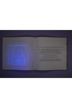 Load image into Gallery viewer, Soft Opening – The Blacklight Book Full Of Surprises
